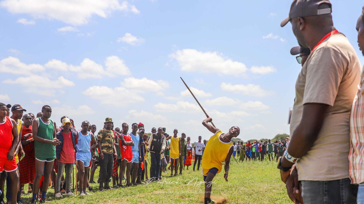 A Maasai Moran throwing a Javelin spear during the Maasai olympics 2024