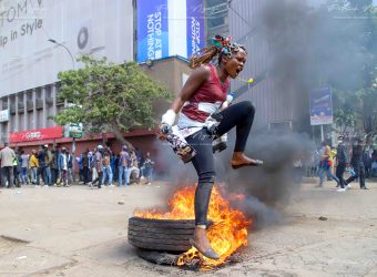 A young lady protesting in the streets of Nairobi